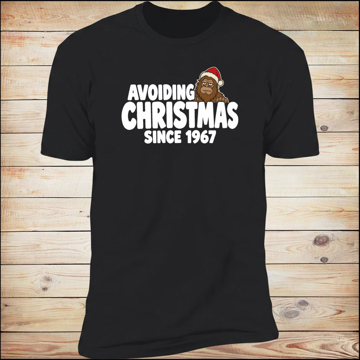 Avoiding Christmas Since 1967 tee, on wood