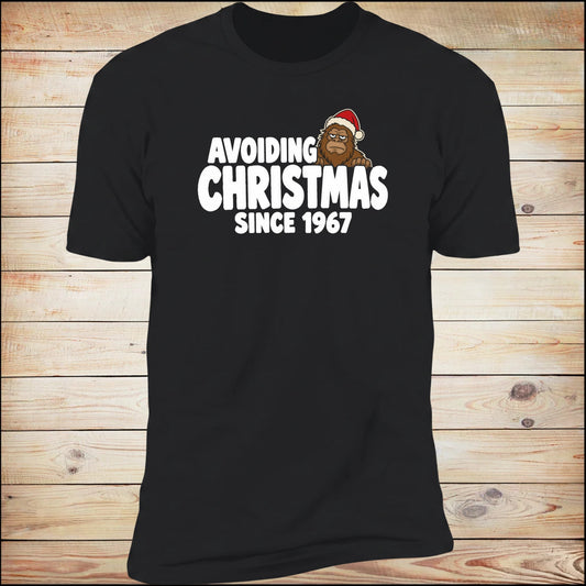 Avoiding Christmas Since 1967 tee, on wood